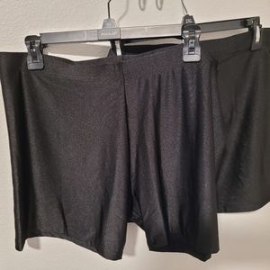 Two pairs of shiny loose biker shorts